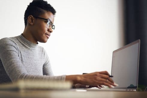 Man at computer typing
